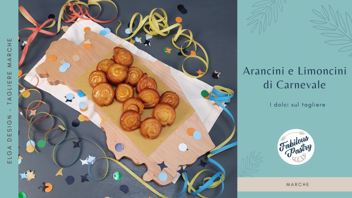 Arancini e limoncini di Carnevale serviti su tagliere in legno di faggio regione Marche